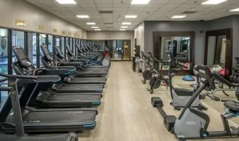 Fully equipped fitness center at Hilton Minneapolis.