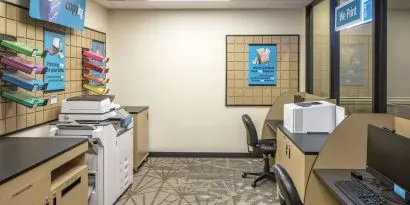 Business center with computers, printers and ergonomic chairs at Hilton Minneapolis.
