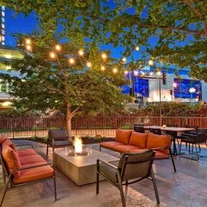 Hotel terrace with lounge seating and fire pit at Hilton Minneapolis.