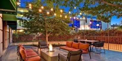 Hotel terrace with lounge seating and fire pit at Hilton Minneapolis.