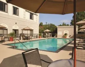 Outdoor pool with lounge seating at Hilton Garden Inn Houston NW/Willowbrook.