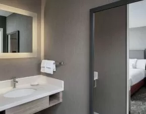 Sonesta Select Nashville Airport Suites double bed guest room, with ensuite bathroom.