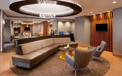 Co-working space is available in the lobby lounge, which features a sofa and pair of stylish chairs, plus a coffee table and TV.