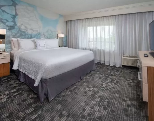 Double bed guest room in Sonesta Select Allentown Bethlehem Airport, featuring window and TV.