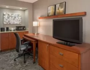 Sonesta Select Seattle Bellevue Redmond guest room workspace, featuring desk and chair, plus TV.