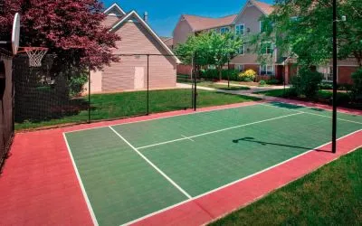 The hotel’s basketball court is located next to the patio, with lush lawns on either side.