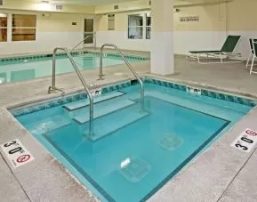 Relaxing indoor pool area at Country Inn & Suites By Radisson, Chicago O'Hare South.