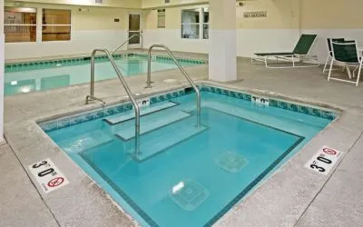 Relaxing indoor pool area at Country Inn & Suites By Radisson, Chicago O'Hare South.