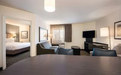 Spacious king room with work space at Sonesta Simply Suites Detroit Warren.