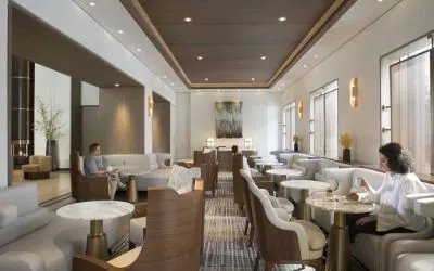 The hotel’s Living Room is furnished with comfortable seating and small tables, where guests can socialize, co-work, or have a drink.