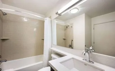 Sonesta Simply Suites Salt Lake City Airport guest bathroom, furnished with sink lavatory, and bathtub (including shower).