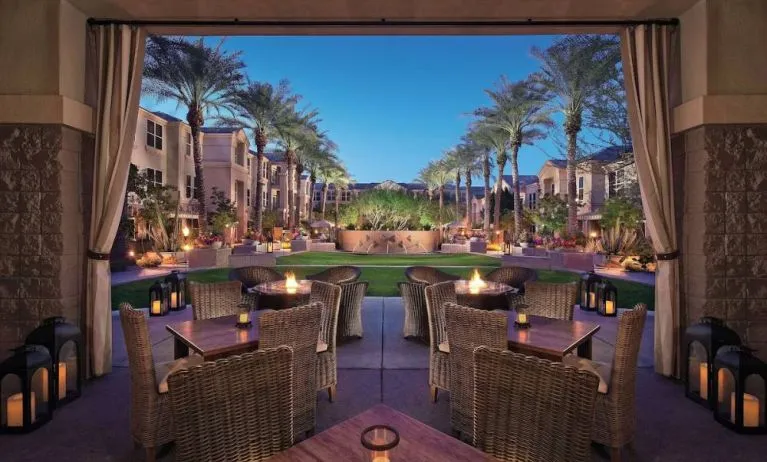 Sonesta Suites Scottsdale Gainey Ranch’s fire pits are surrounded by comfy chairs, with more tables and chairs, and candle-style lights, nearby for outdoor socializing.