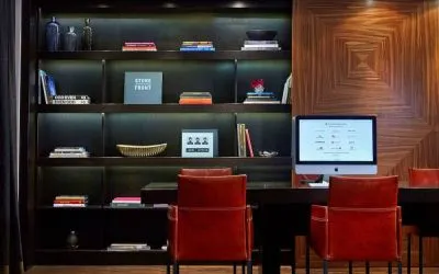 The hotel’s business center is located in the lobby and has a computer workstation and numerous chairs for co-working.