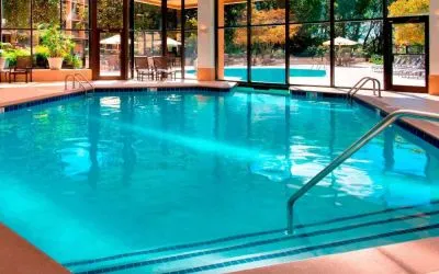 The hotel’s indoor pool has chairs by the side and a direct water link to the outside pool.