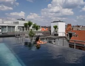 Relaxing rooftop pool at Wilmina Hotel.