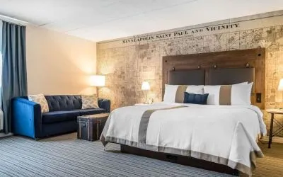 King bed with natural light at EnVision Hotel St. Paul South.