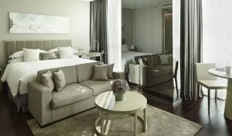 Spacious king room with lounge at Fraser Residence Menteng Jakarta.