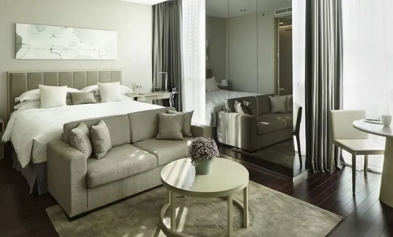 Spacious king room with lounge at Fraser Residence Menteng Jakarta.