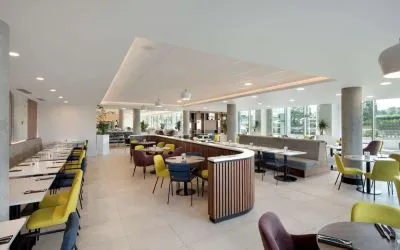 Lounge and coworking space at Hampton By Hilton London Stansted Airport.