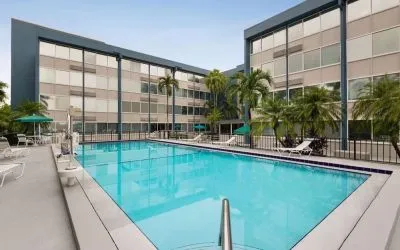 Beautiful outdoor pool at EnVision Hotel Miami International Airport.