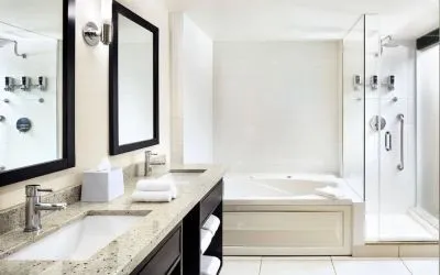 Guest bathroom with shower and bath at Four Points By Sheraton Mississauga Meadowvale.