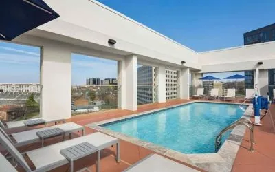 Outdoor pool with loungers at Hilton Garden Inn Nashville West End Avenue.