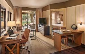 Spacious day room with work station at Sonesta Suites Scottsdale Gainey Ranch.