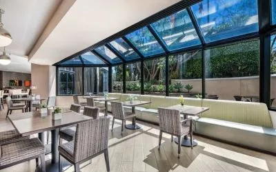 Dining area with natural light at Sonesta Los Angeles Airport LAX.