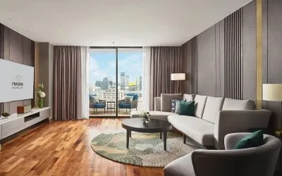 Beautiful king room with lounge and terrace at Fraser Suites Sukhumvit, Bangkok.