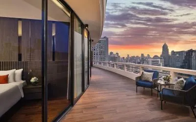 Outdoor terrace with seating area at Fraser Suites Sukhumvit, Bangkok.