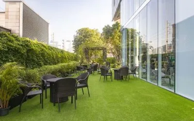 Outdoor garden with seating area at Modena By Fraser Bangkok.