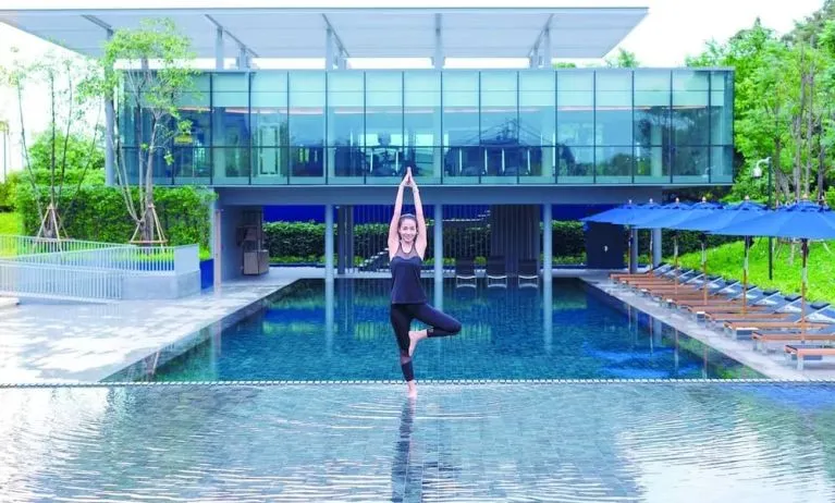 Outdoor pool and fitness space at Modena By Fraser Buriram.