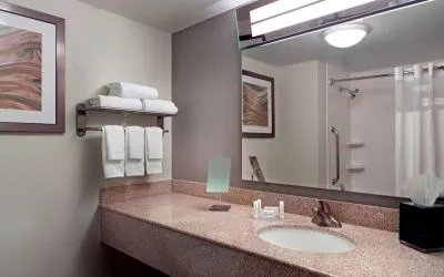 Guest bathroom with showre at Sonesta Select Atlanta Cumberland Galleria.