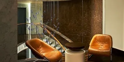 Cozy lounge area at The Fifty Sonesta Select New York.
