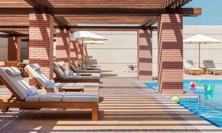 Outdoor lounge chairs at Hilton Dubai Al Habtoor City.
