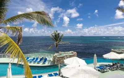 Relaxing outdoor pool and ocean view at Oyster Bay Beach Resort.
