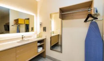 Guest bathroom with shower at Palace Inn Blue IAH East.