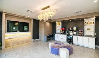 Lobby and lounge area at Palace Inn Blue IAH East.