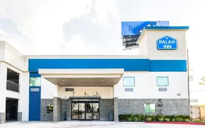 Hotel exterior at Palace Inn Blue IAH East.