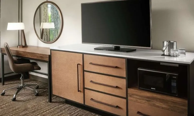 Work space with desk and TV at DoubleTree By Hilton Ontario Airport.