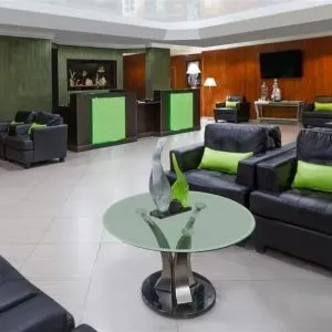 Lounge and coworking space at Uptown Oasis San Jose Airport.