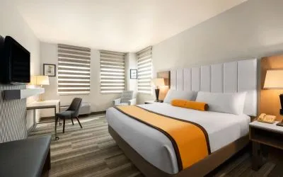 King room with TV at Hotel Marguerite.