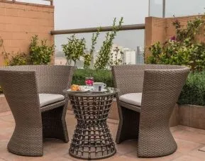 Terrace and seating area at Suites Perisur Furnished Apartments.