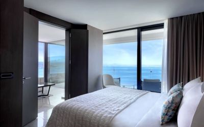 Romantic king room with natural light at Le Méridien Bodrum Beach Resort.