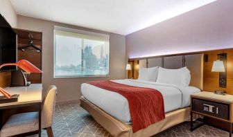 Day use room with work desk and natural light at Comfort Inn JFK Airport.