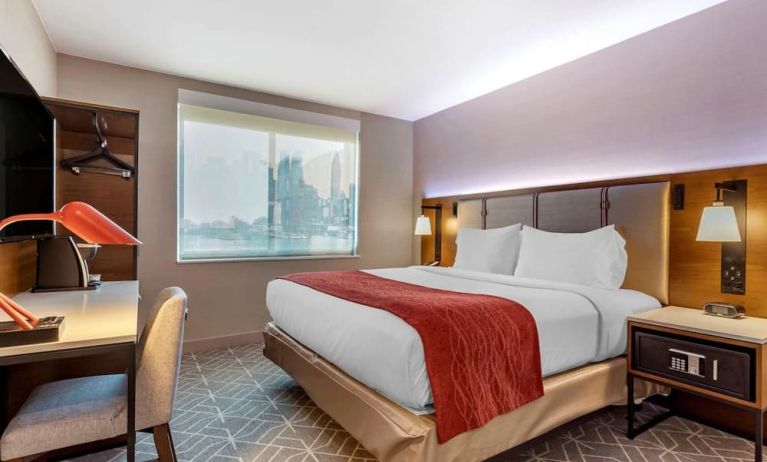 Day use room with work desk and natural light at Comfort Inn JFK Airport.