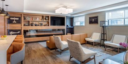 Coworking lounge at Comfort Inn JFK Airport.