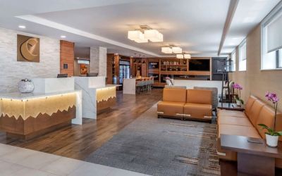 Lobby and coworking lounge at Comfort Inn JFK Airport.