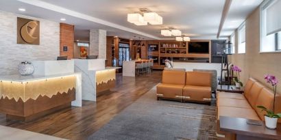 Lobby and coworking lounge at Comfort Inn JFK Airport.