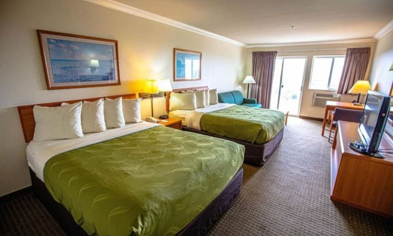 Two queen beds at Coratel Inn And Suites By Jasper Ocean Shores.